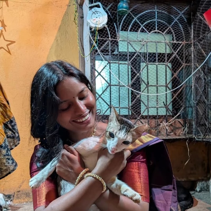 Rutuja Jadhav holding a cat at the shelter